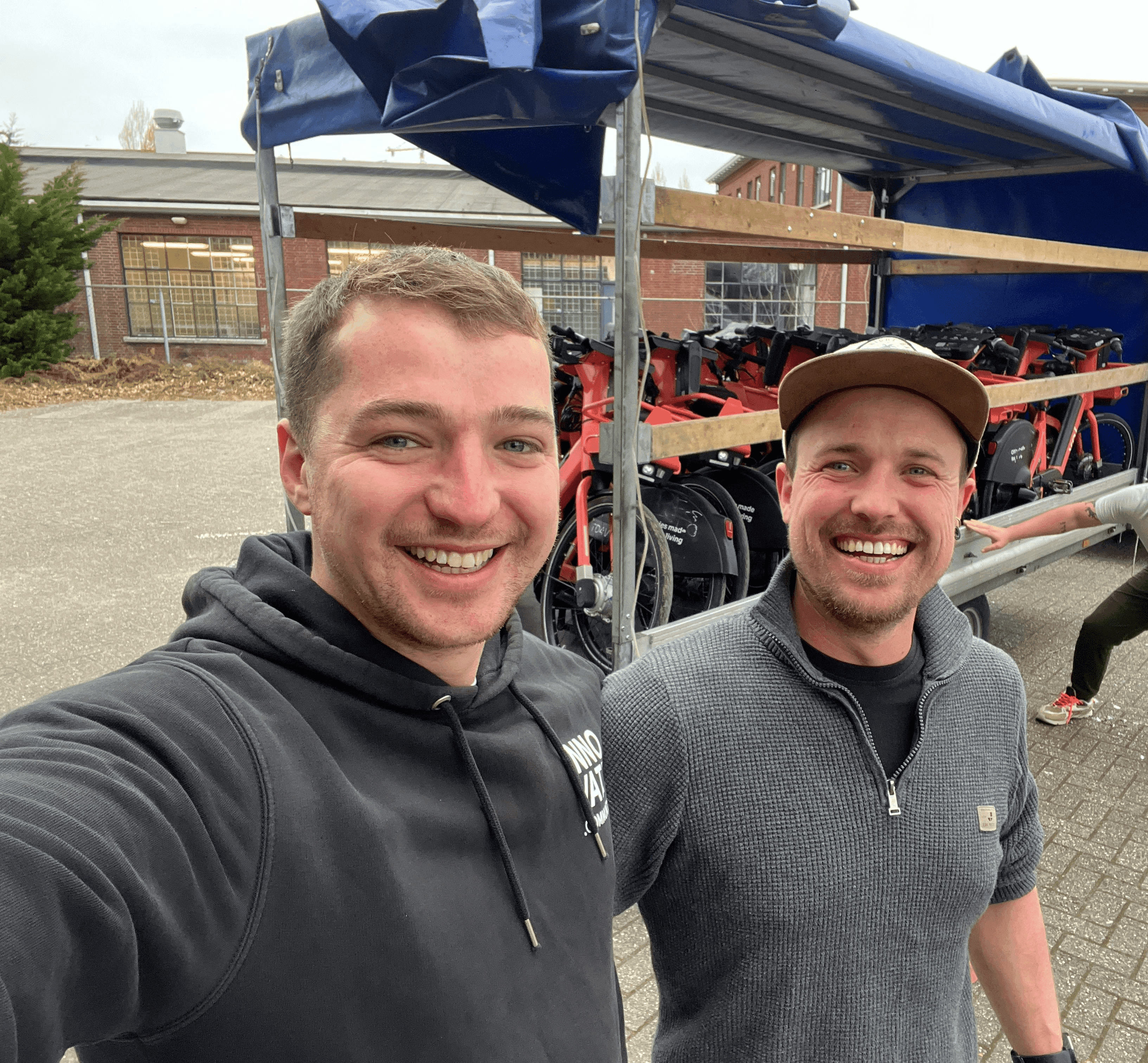 Two of the Fleetser team in front of a fleet being prepared for collection